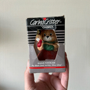 Caring critter collectible porcelain ornament.